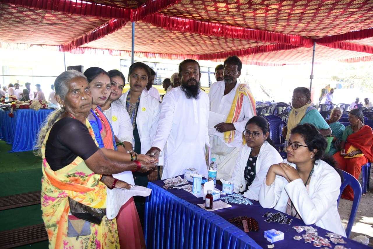 A doctor examining a patient at a health camp
